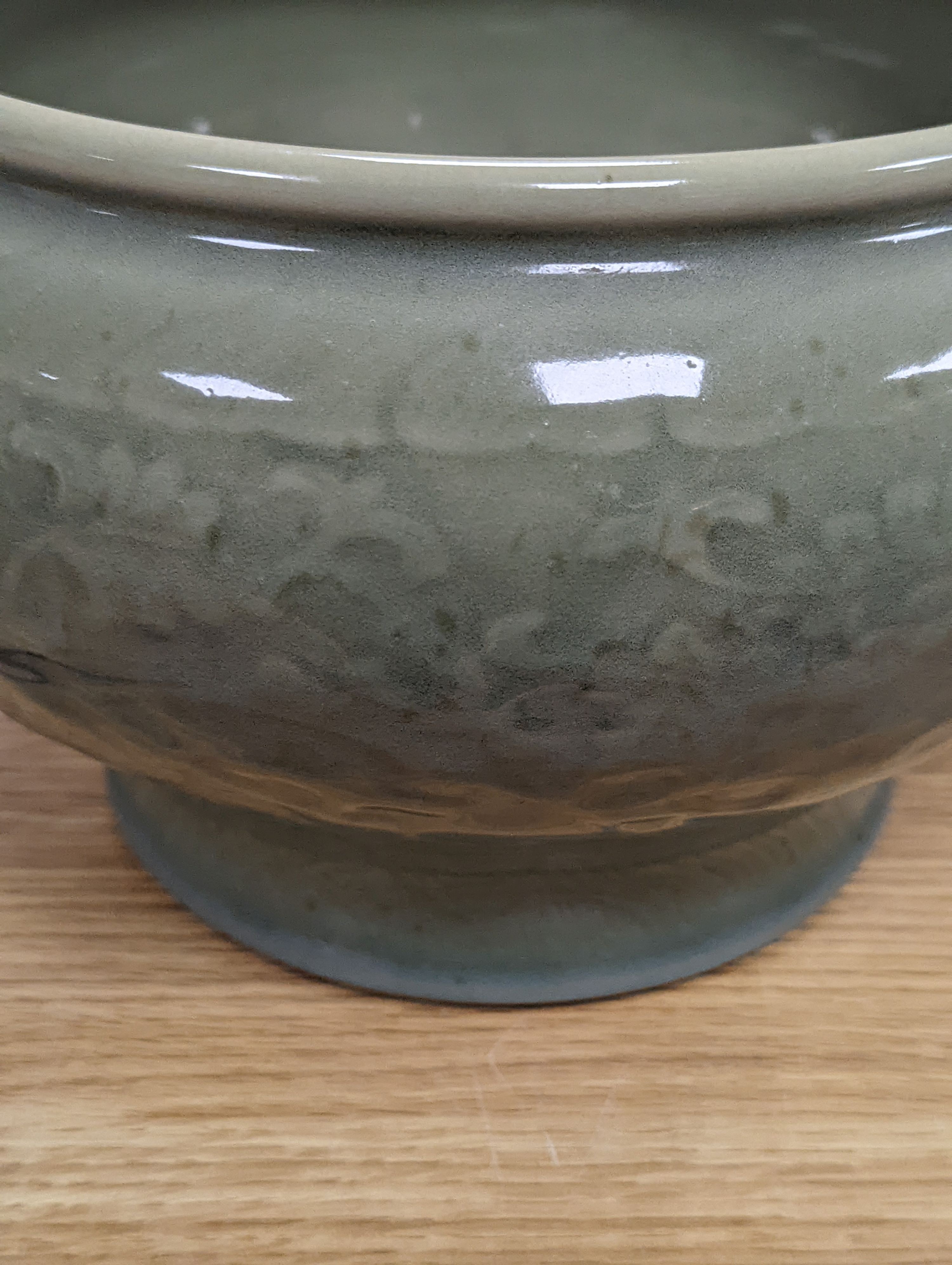 A Chinese celadon glazed bowl - 17.5cm tall